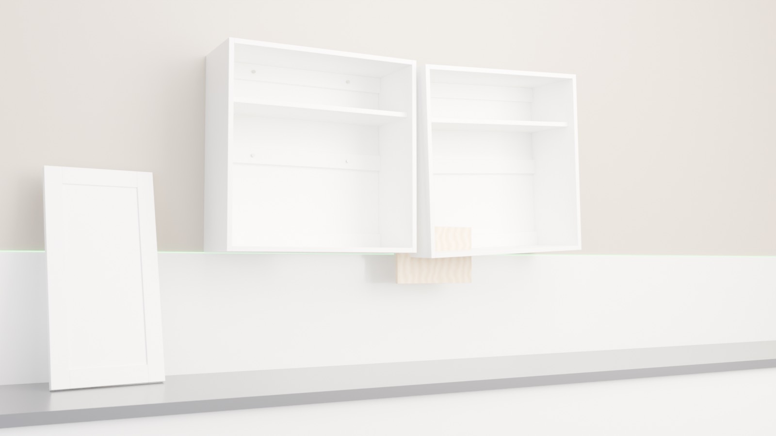 3D render: two white frameless cabinet boxes on a warm wall — the second box rests on a plywood cleat screwed to the first box's gable; a shaker door leans on the counter; a green laser line marks the level line; three horizontal mounting rails on each back
